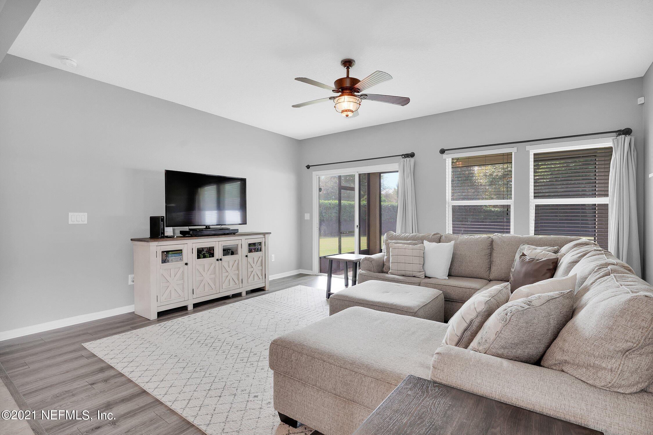 16342 Tisons Bluff Road Jacksonville, FL 32218 - Photo 14 of 57 a living room with furniture and a flat screen tv
