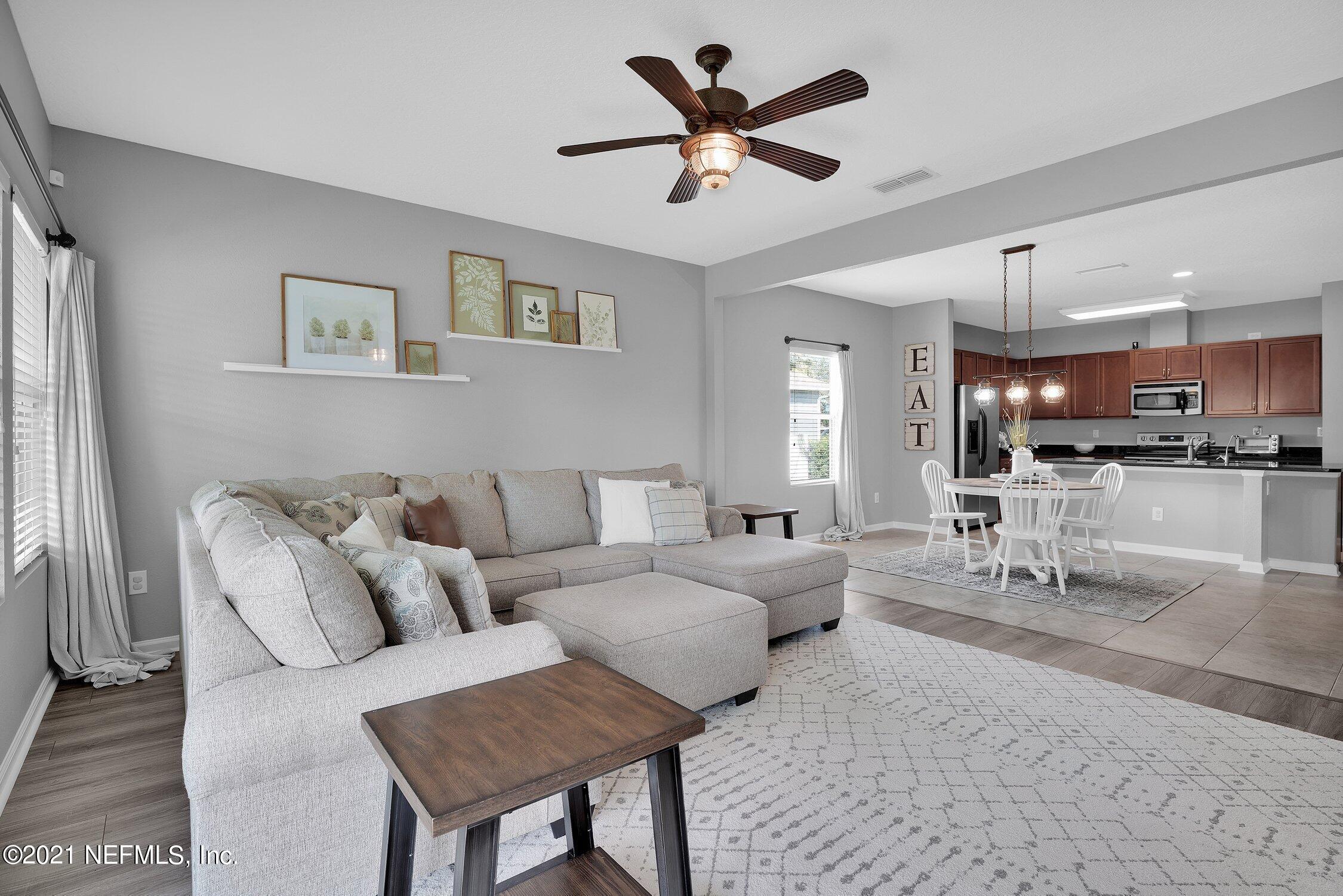 16342 Tisons Bluff Road Jacksonville, FL 32218 - Photo 15 of 57 a living room with furniture and kitchen view