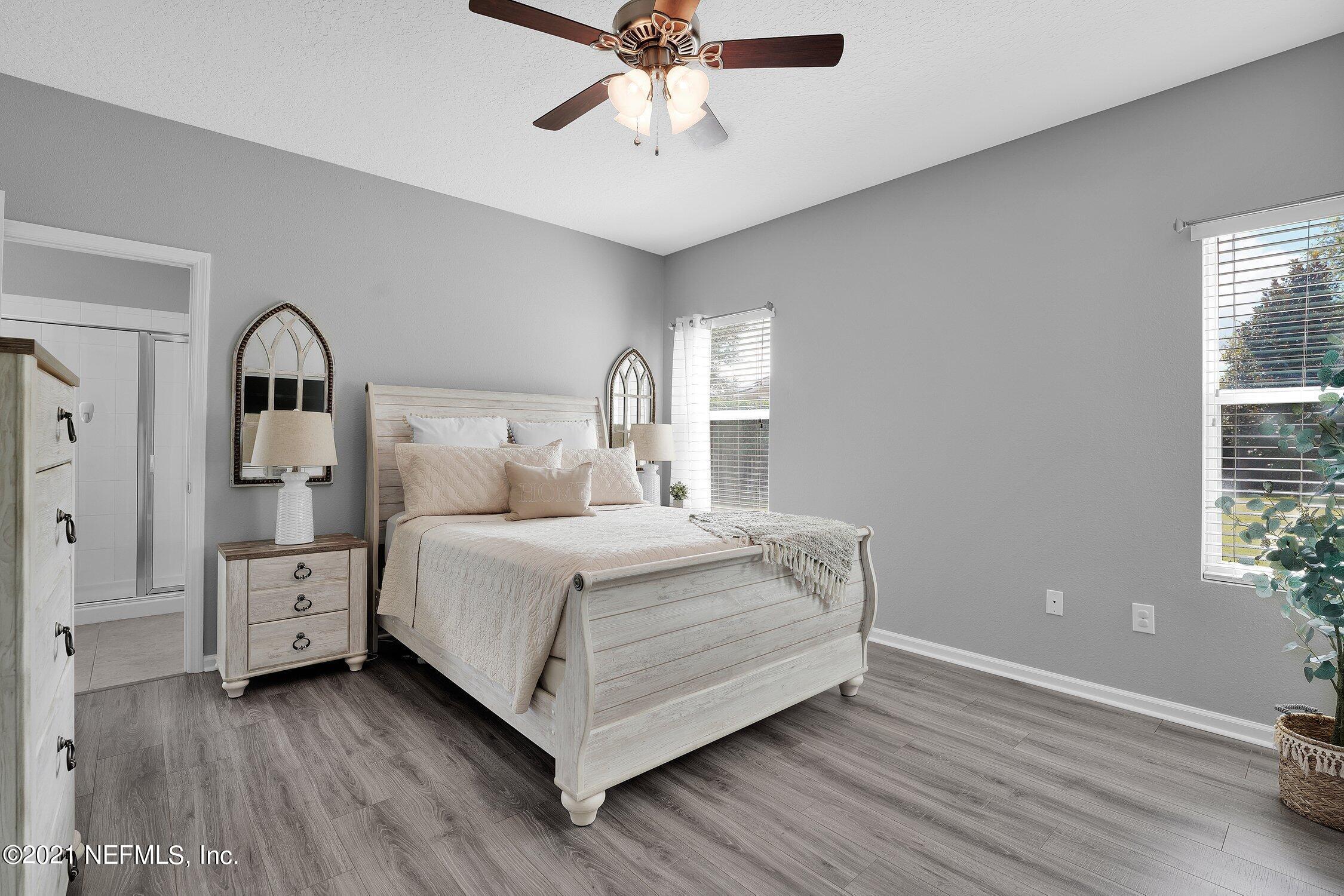 16342 Tisons Bluff Road Jacksonville, FL 32218 - Photo 16 of 57 a bedroom with a bed and window