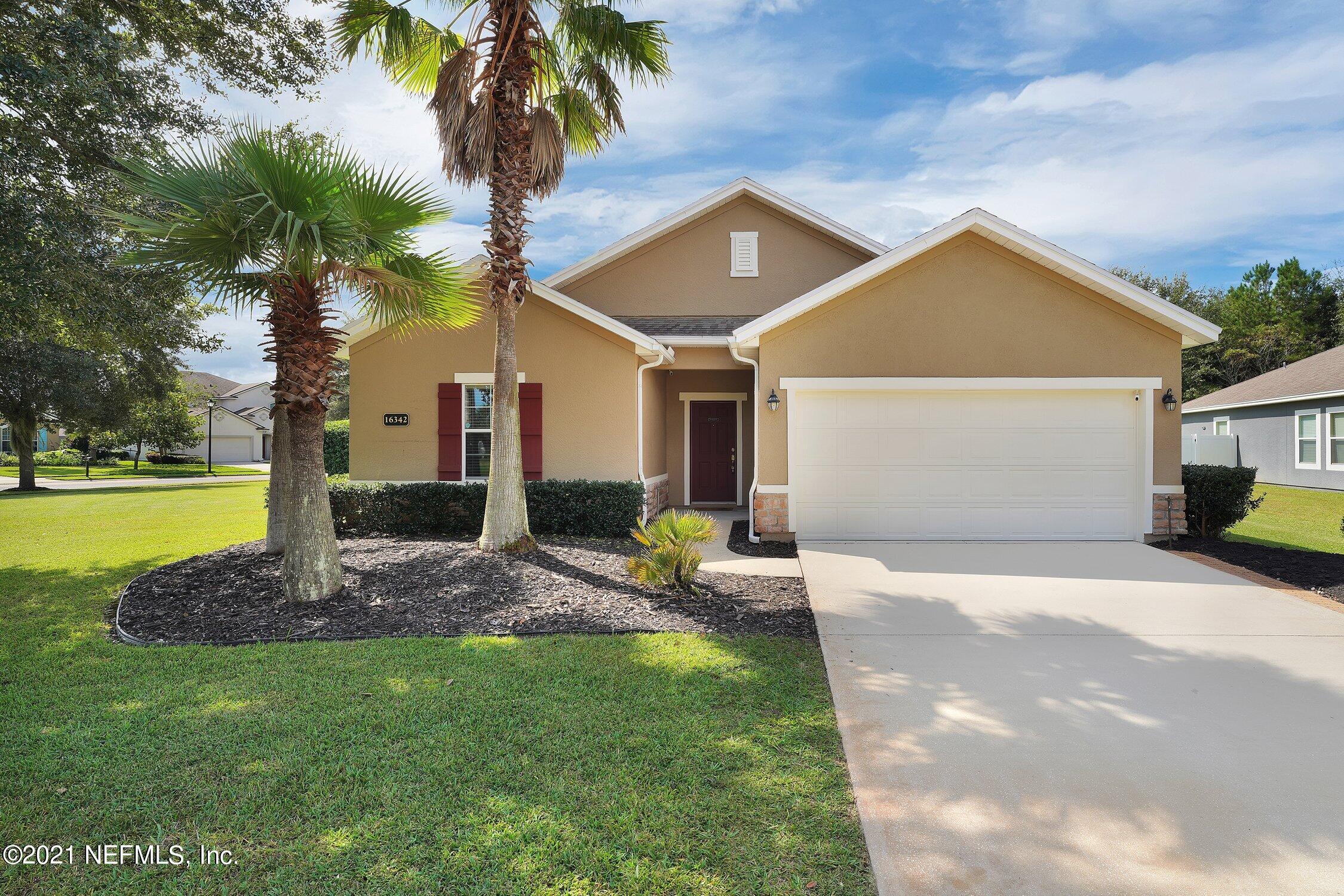 16342 Tisons Bluff Road Jacksonville, FL 32218 - Photo 2 of 57 a front view of a house with garden