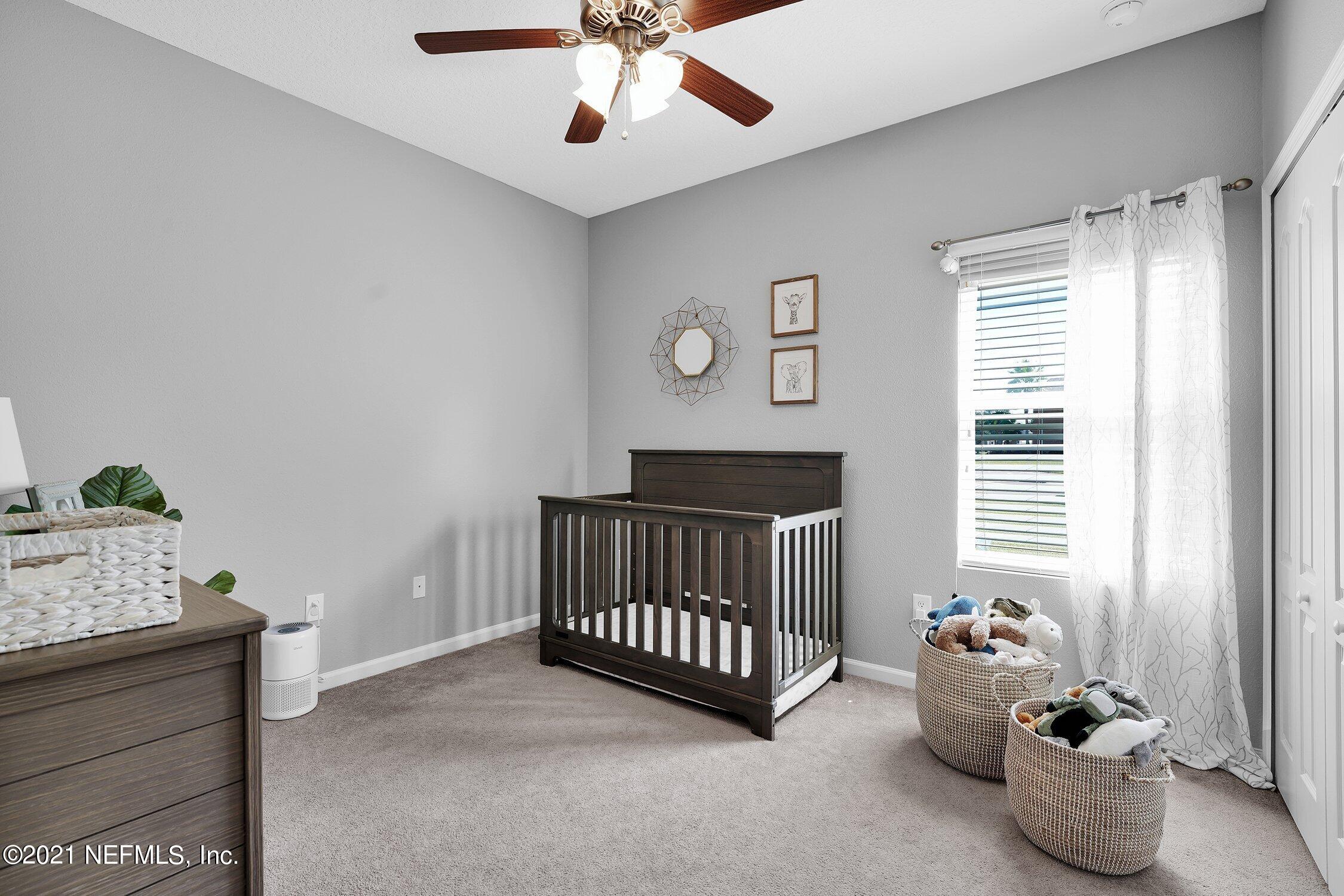 16342 Tisons Bluff Road Jacksonville, FL 32218 - Photo 21 of 57 a bedroom with furniture and a window