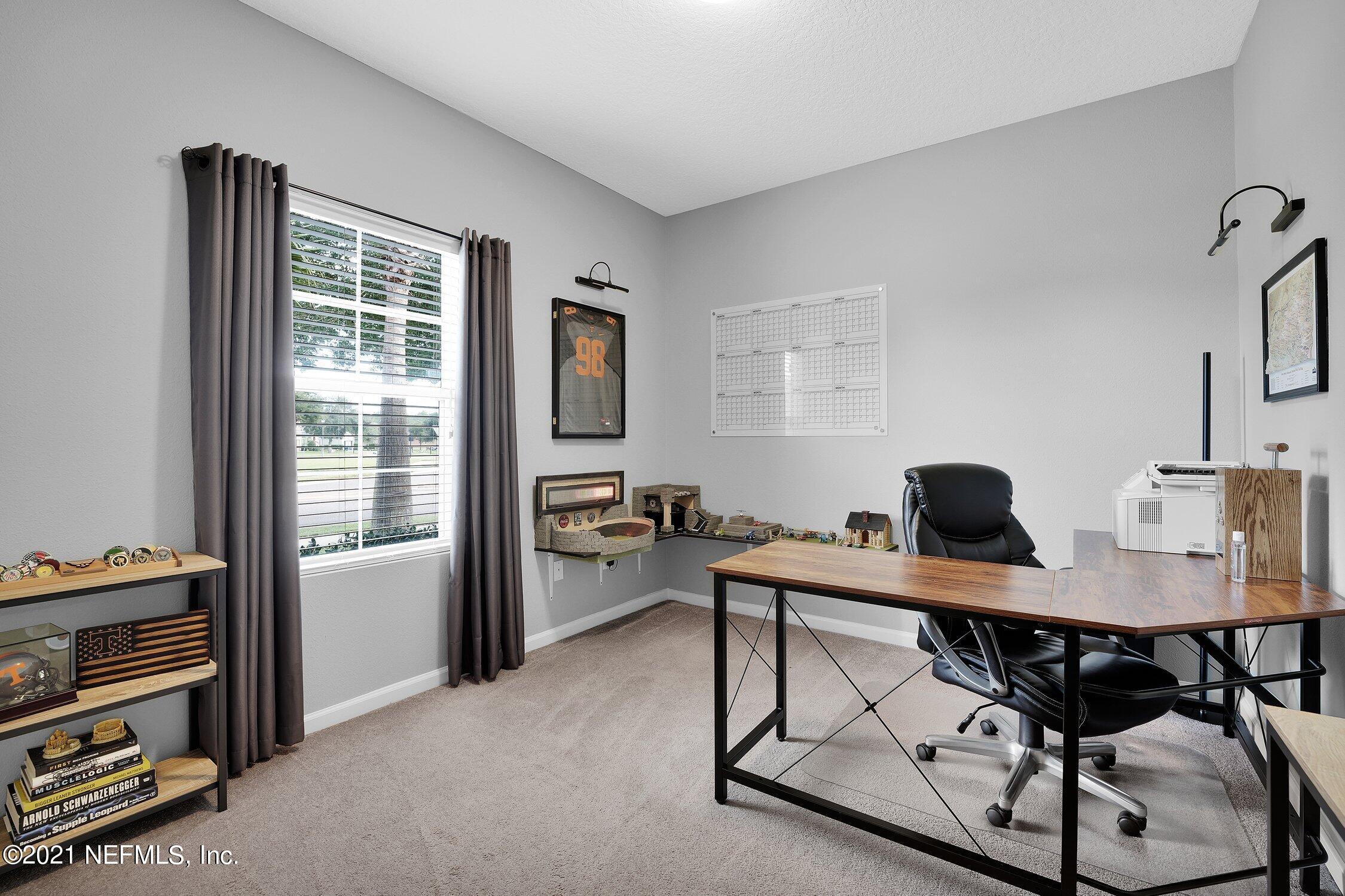 16342 Tisons Bluff Road Jacksonville, FL 32218 - Photo 24 of 57 a view of a workspace with furniture and a window