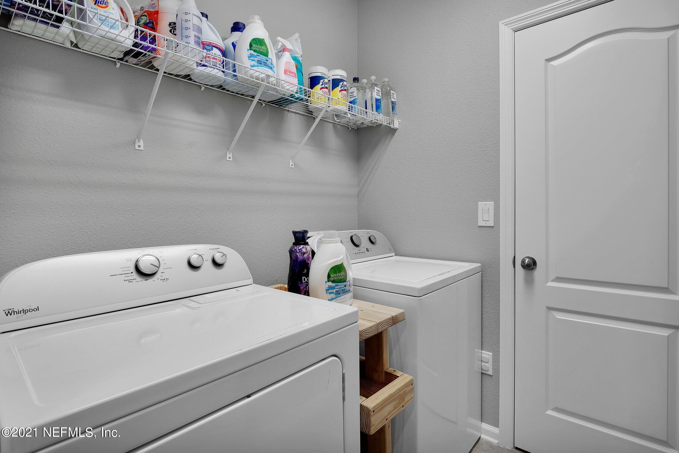 16342 Tisons Bluff Road Jacksonville, FL 32218 - Photo 25 of 57 a utility room with dryer and washer