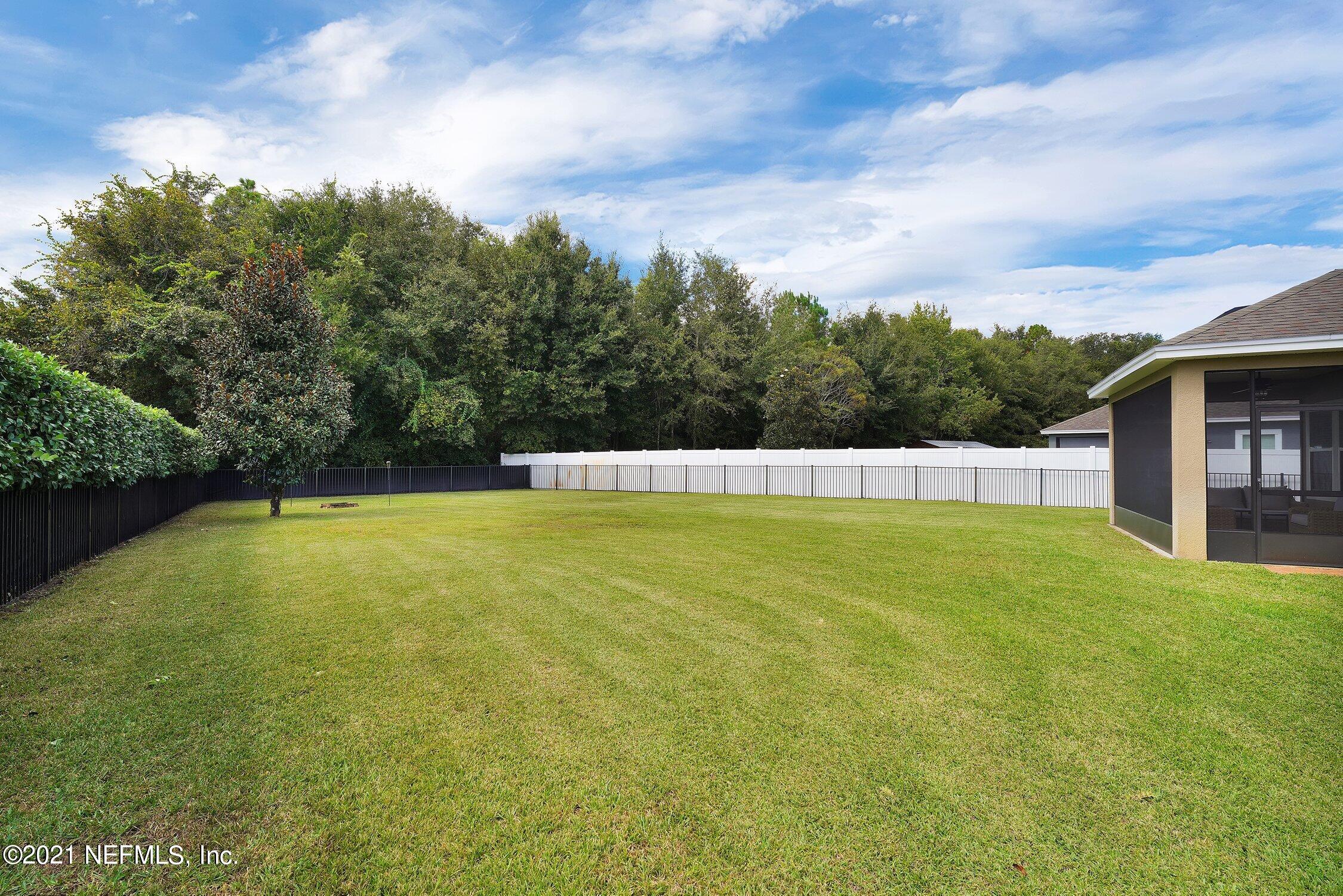 16342 Tisons Bluff Road Jacksonville, FL 32218 - Photo 29 of 57 a view of a swimming pool with an outdoor space