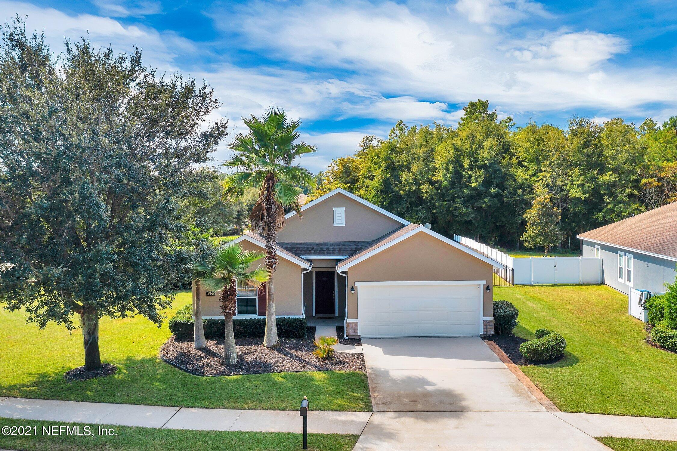 16342 Tisons Bluff Road Jacksonville, FL 32218 - Photo 34 of 57 a front view of a house with a yard