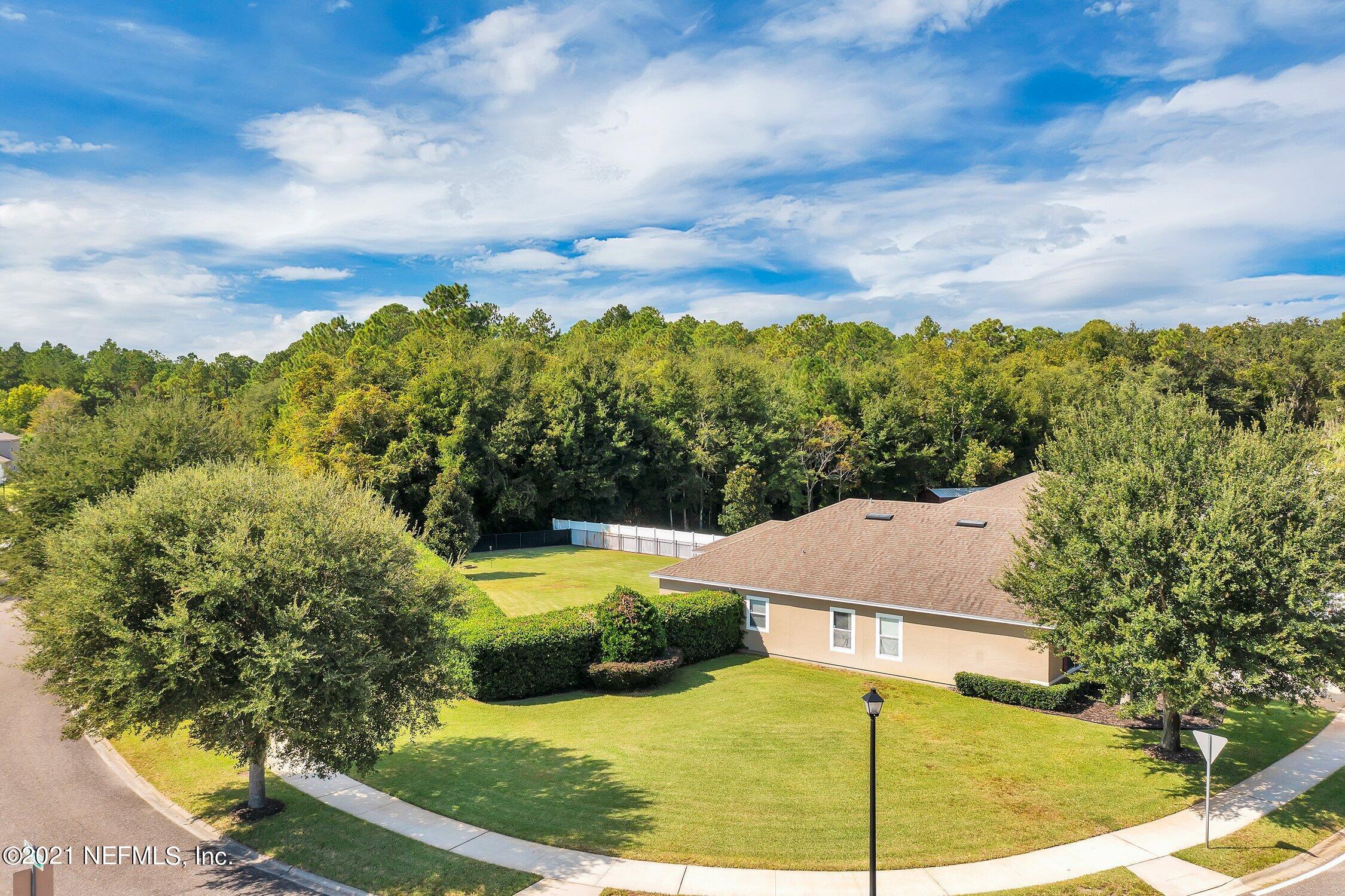 16342 Tisons Bluff Road Jacksonville, FL 32218 - Photo 36 of 57 a view of a swimming pool with a yard