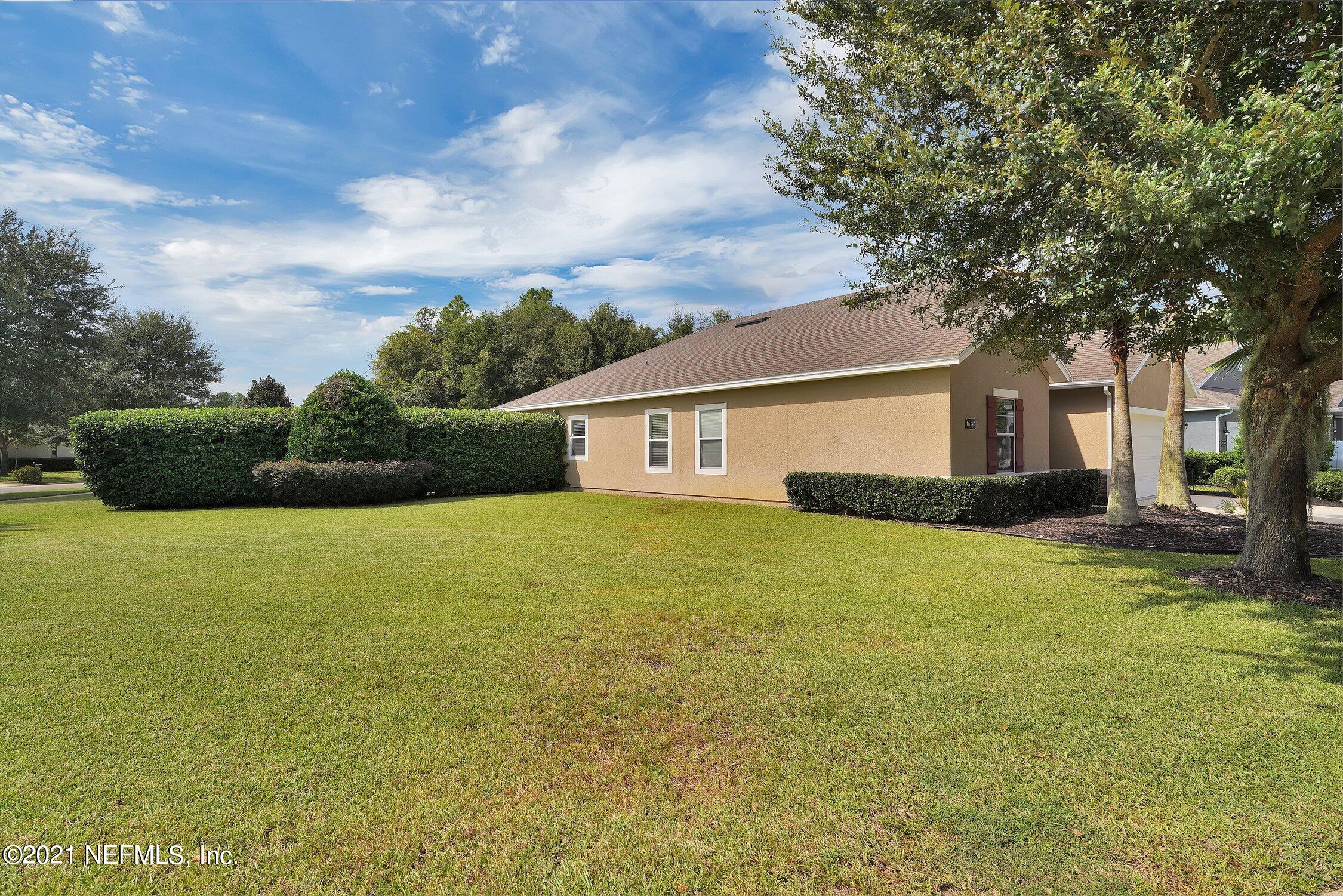 16342 Tisons Bluff Road Jacksonville, FL 32218 - Photo 4 of 57 a front view of a house with a garden