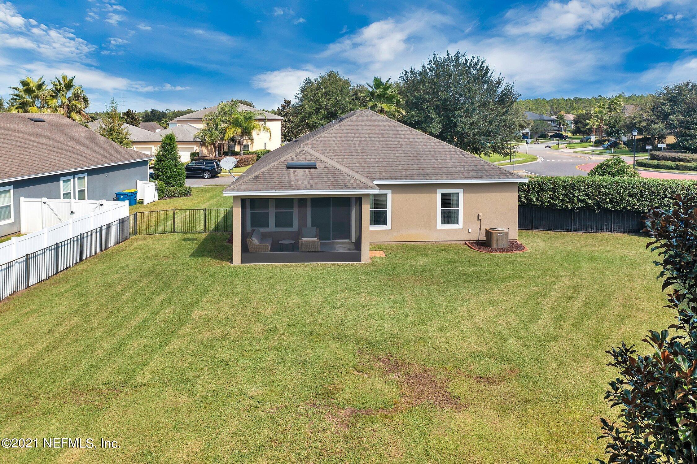 16342 Tisons Bluff Road Jacksonville, FL 32218 - Photo 45 of 57 a house with huge green field in front of it