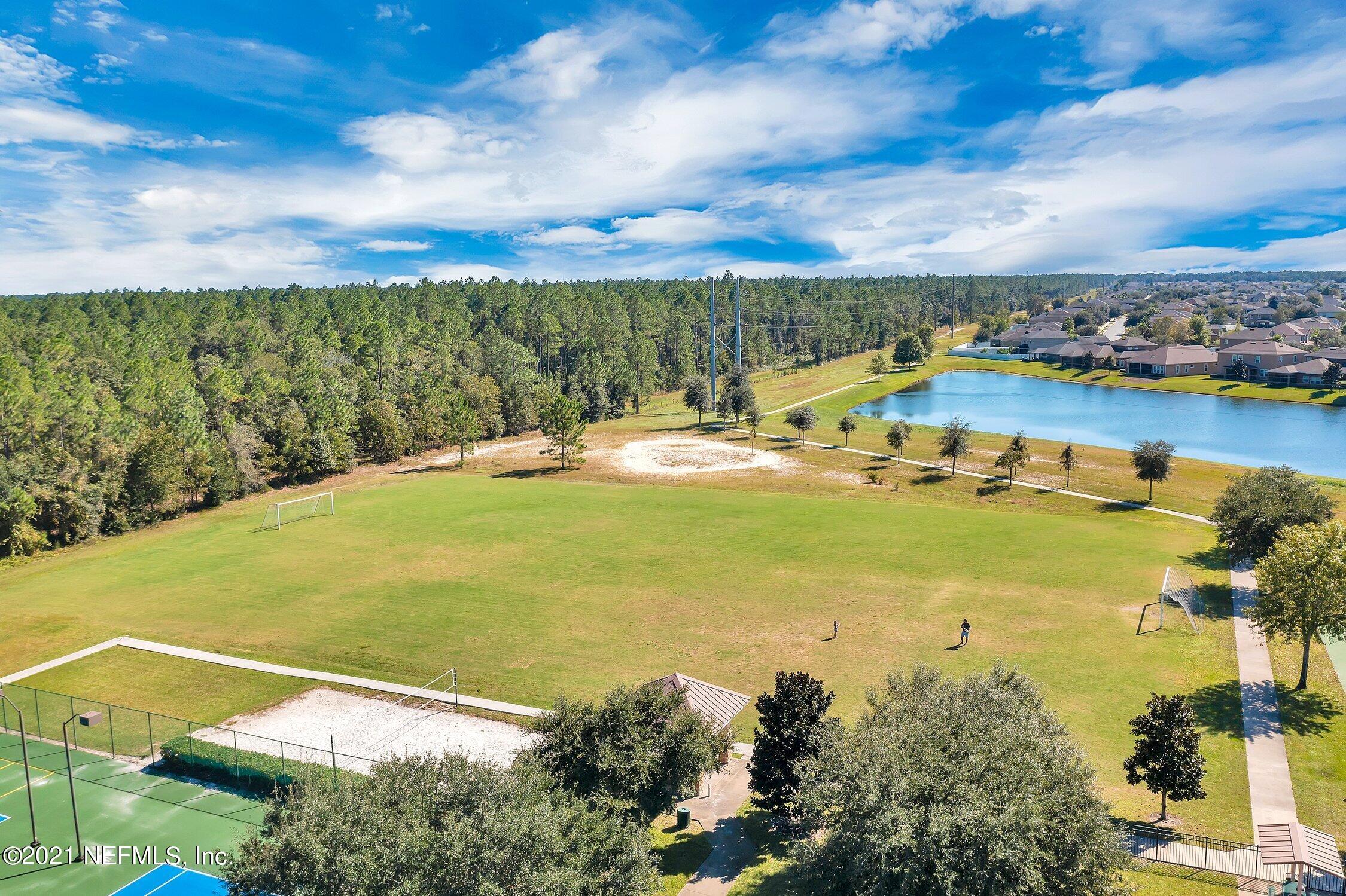 16342 Tisons Bluff Road Jacksonville, FL 32218 - Photo 47 of 57 a view of a lake with a yard