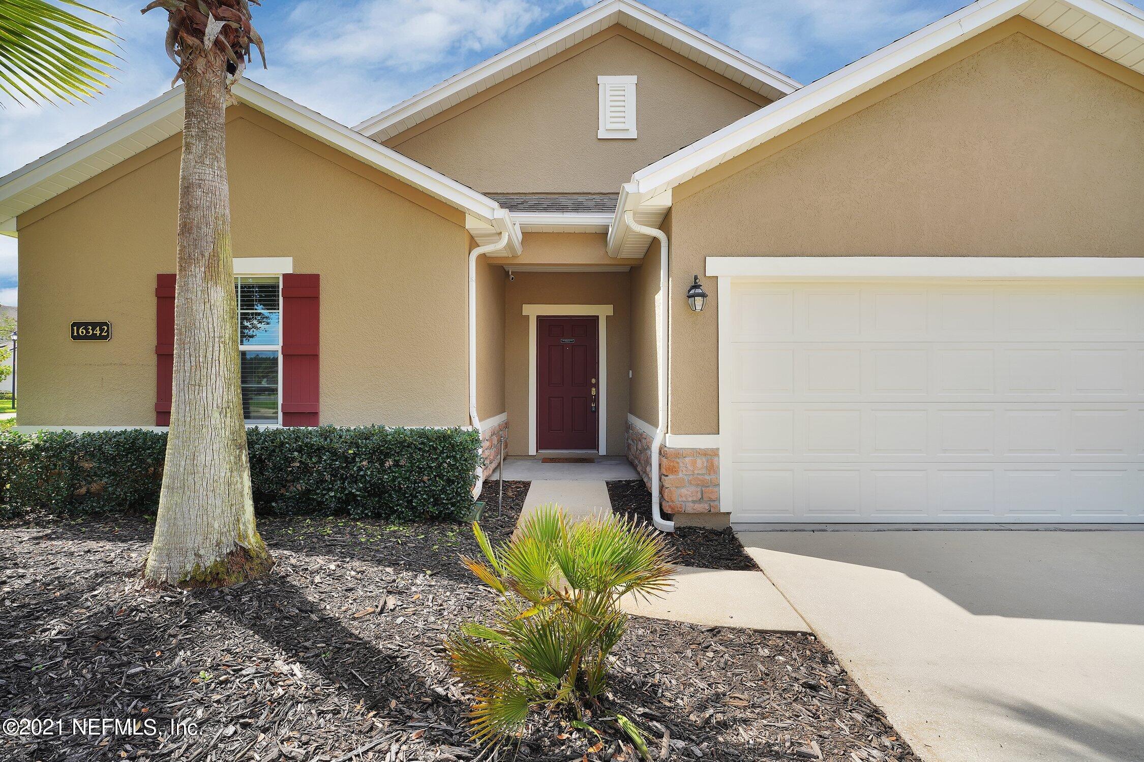16342 Tisons Bluff Road Jacksonville, FL 32218 - Photo 6 of 57 a front view of a house with garden