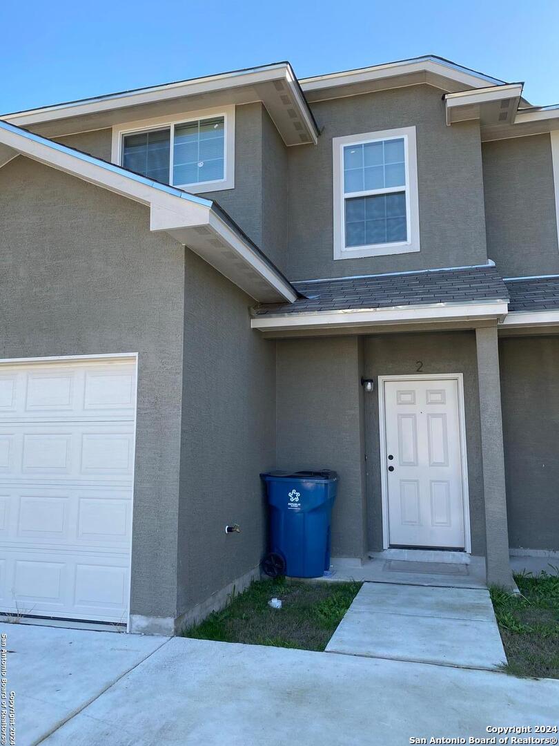 a front view of a house with yard