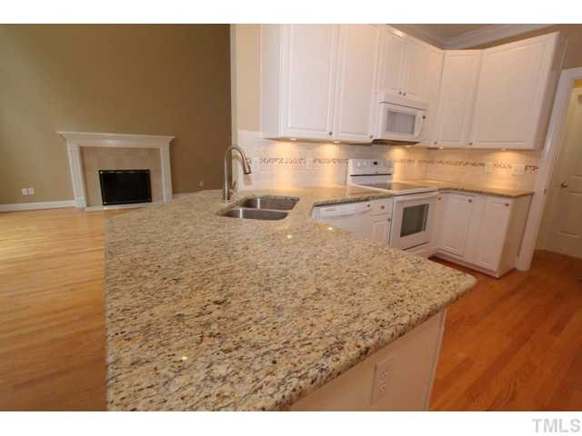 820 Nolstead Court Raleigh, NC 27614 - Photo 6 of 25 Gorgeous granite makes the white cabinets pop. Kitchen