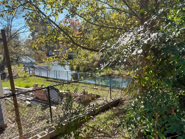 a view of swimming pool with a yard