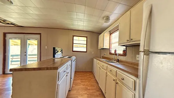 a bathroom with a sink mirror and toilet