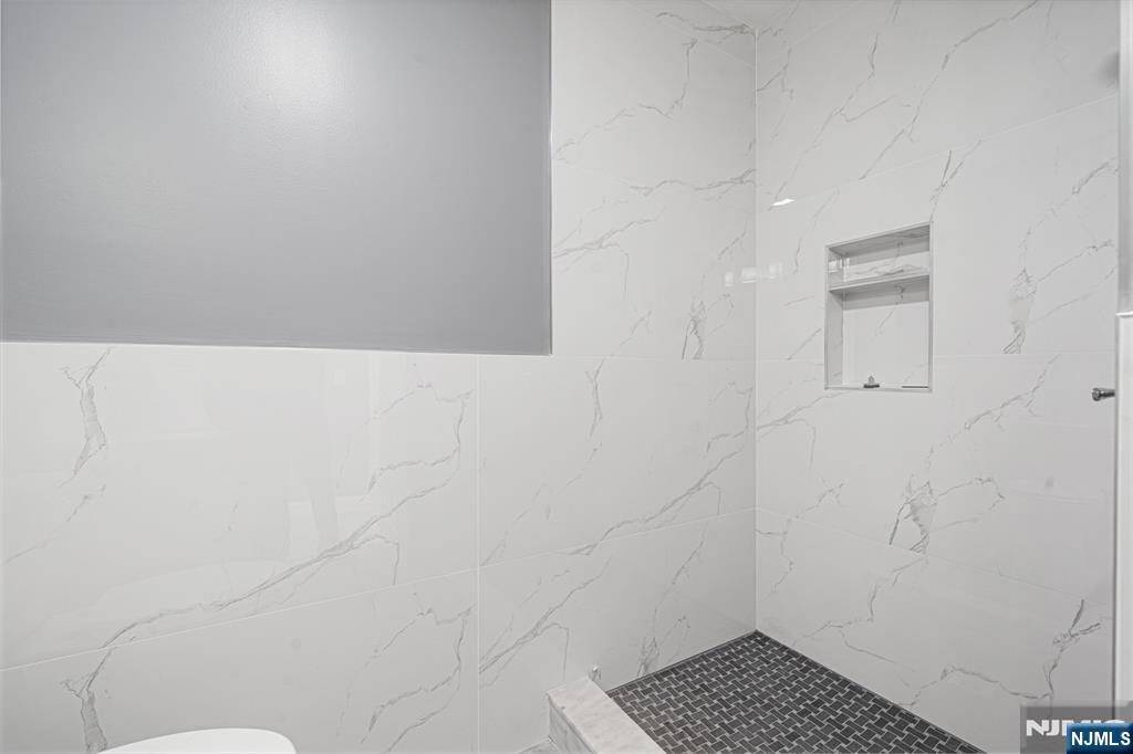 149 Florence Avenue, Unit 2 Hawthorne, NJ 07506 - Photo 2 of 9 close up of a white marble wall