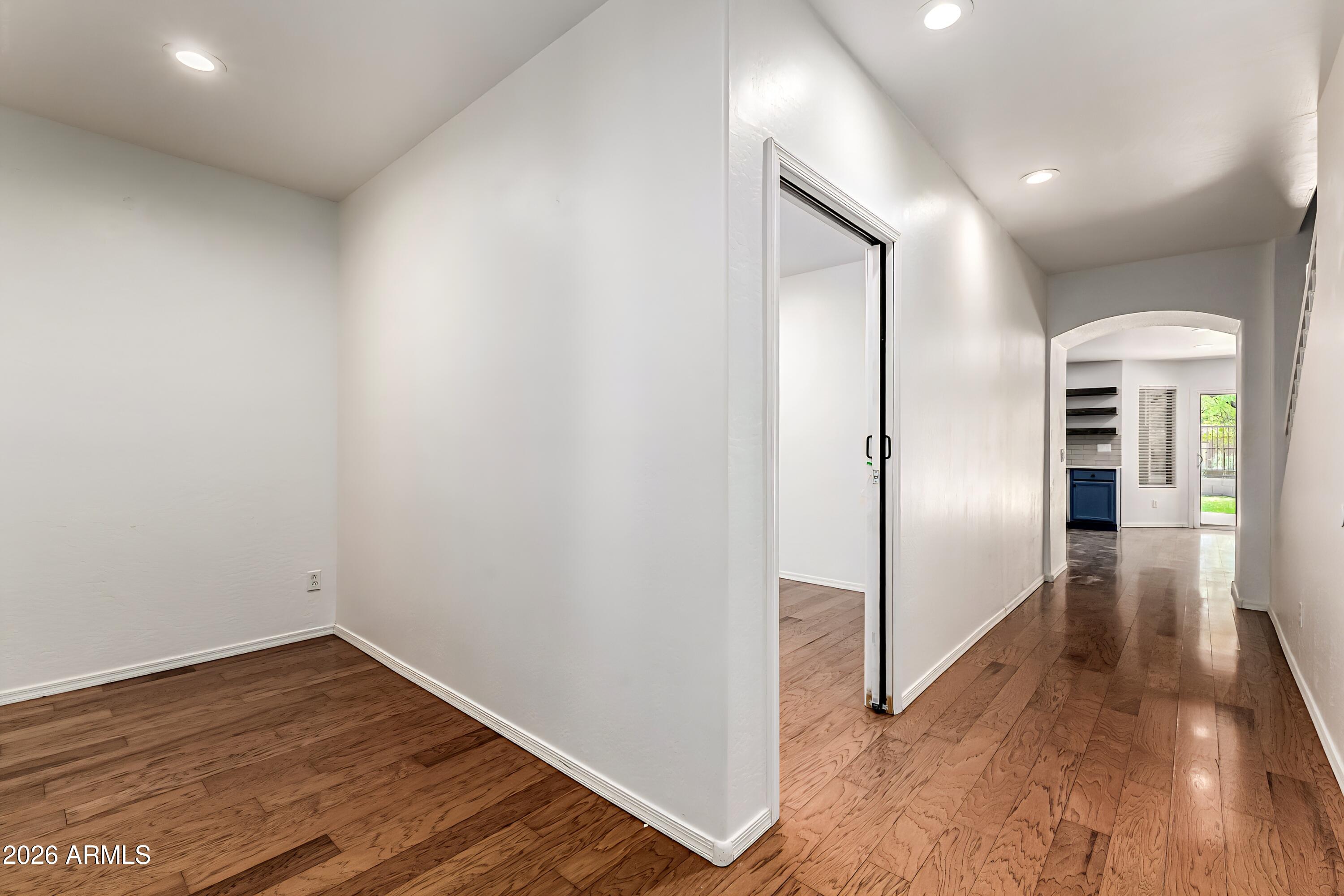 4208 South Sawmill Road Gilbert, AZ 85297 - Photo 7 of 46 a view of a hallway with wooden floor