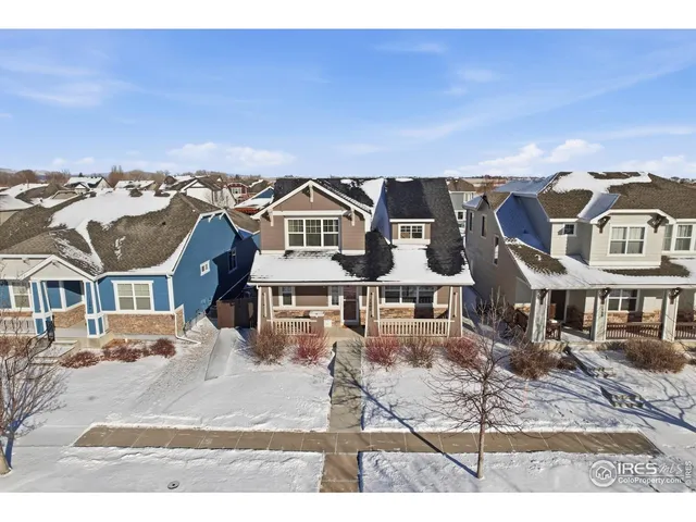 a front view of a building with a yard