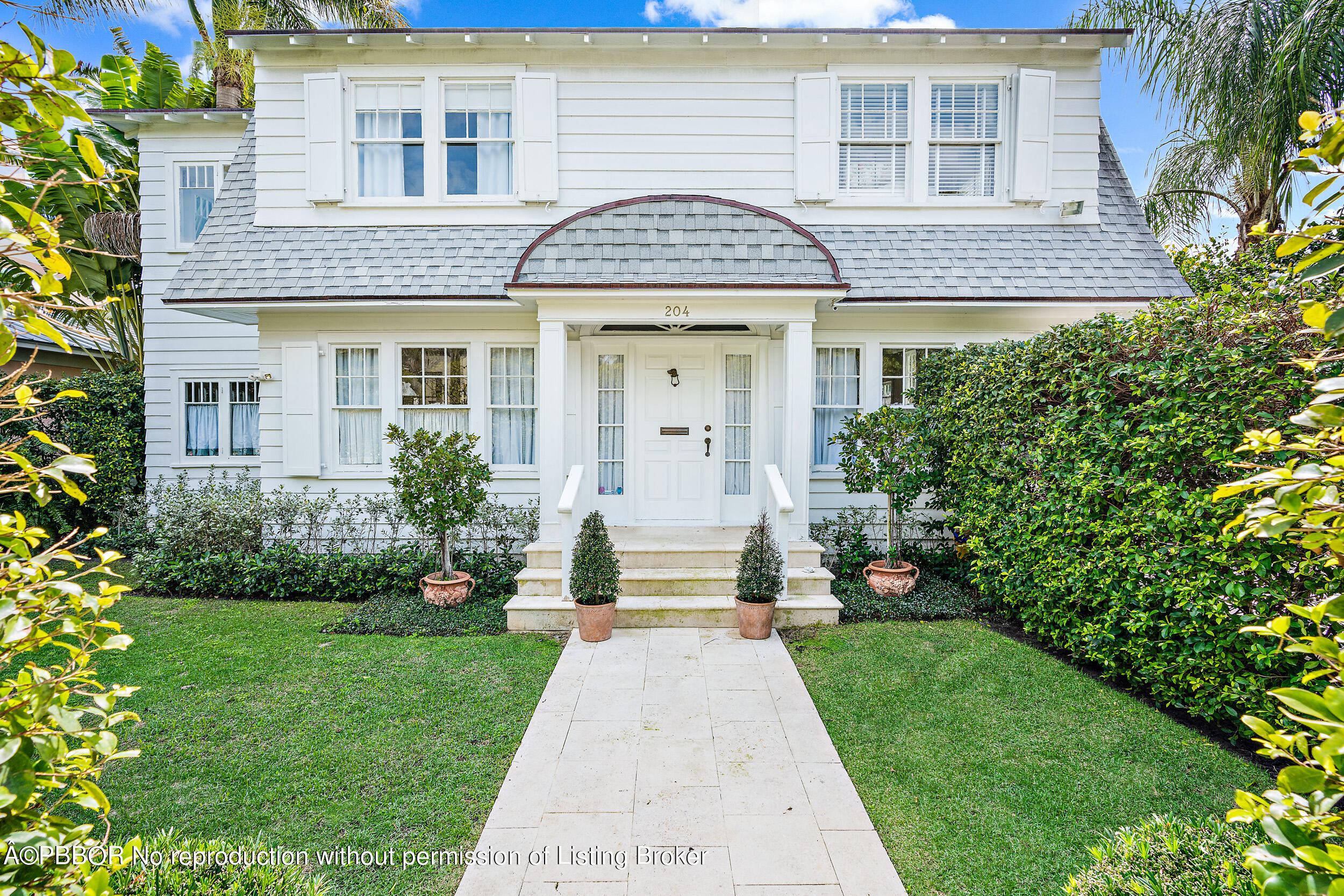 204 Westminster Road West Palm Beach, FL 33405 - Photo 1 of 16 a front view of a house having yard