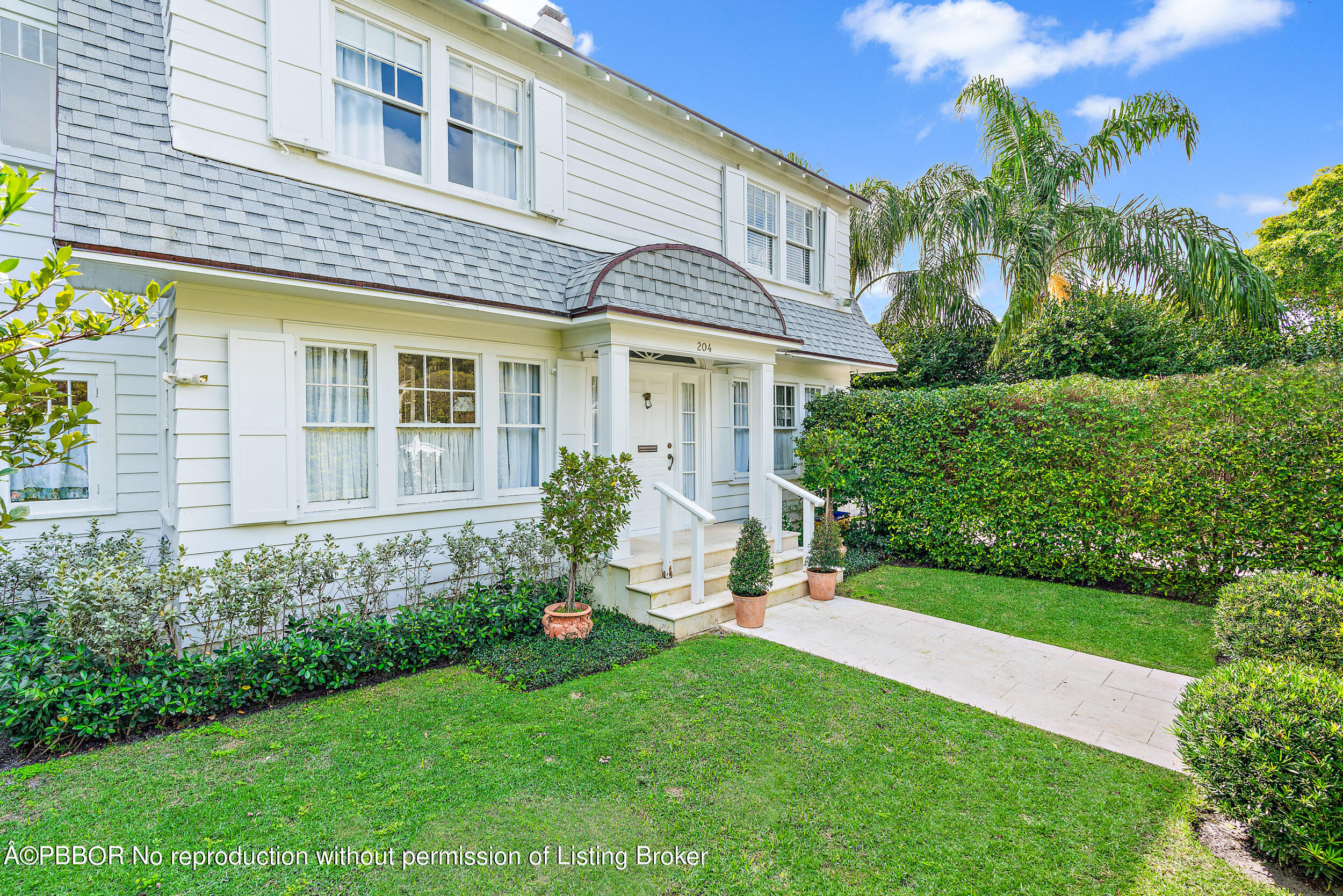 204 Westminster Road West Palm Beach, FL 33405 - Photo 15 of 16 a view of a house with a yard and plants
