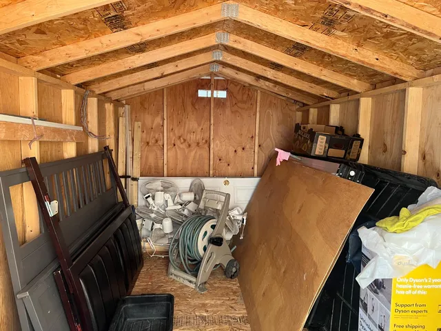 a view of a balcony with furniture