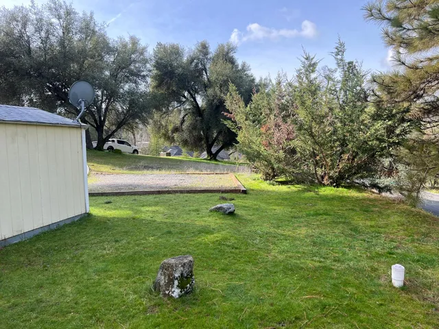 a backyard of a house with lots of green space