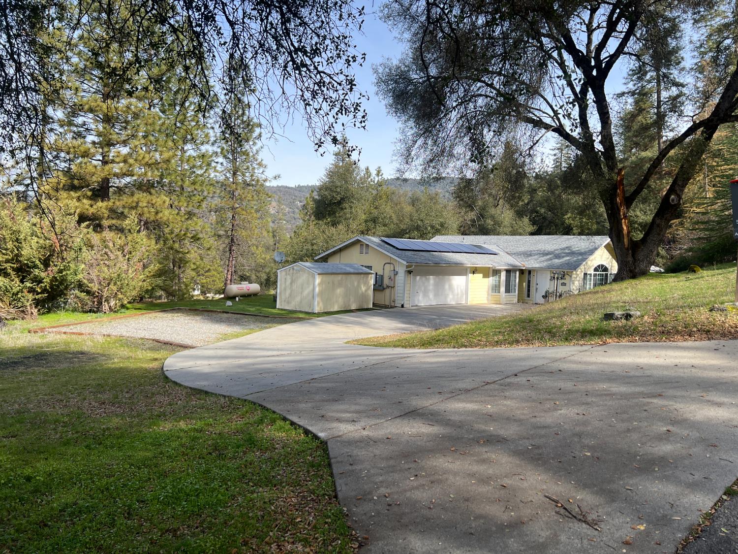 50613 Granite Butte Way Oakhurst, CA 93644 - Photo 31 of 31 a view of a house with a yard