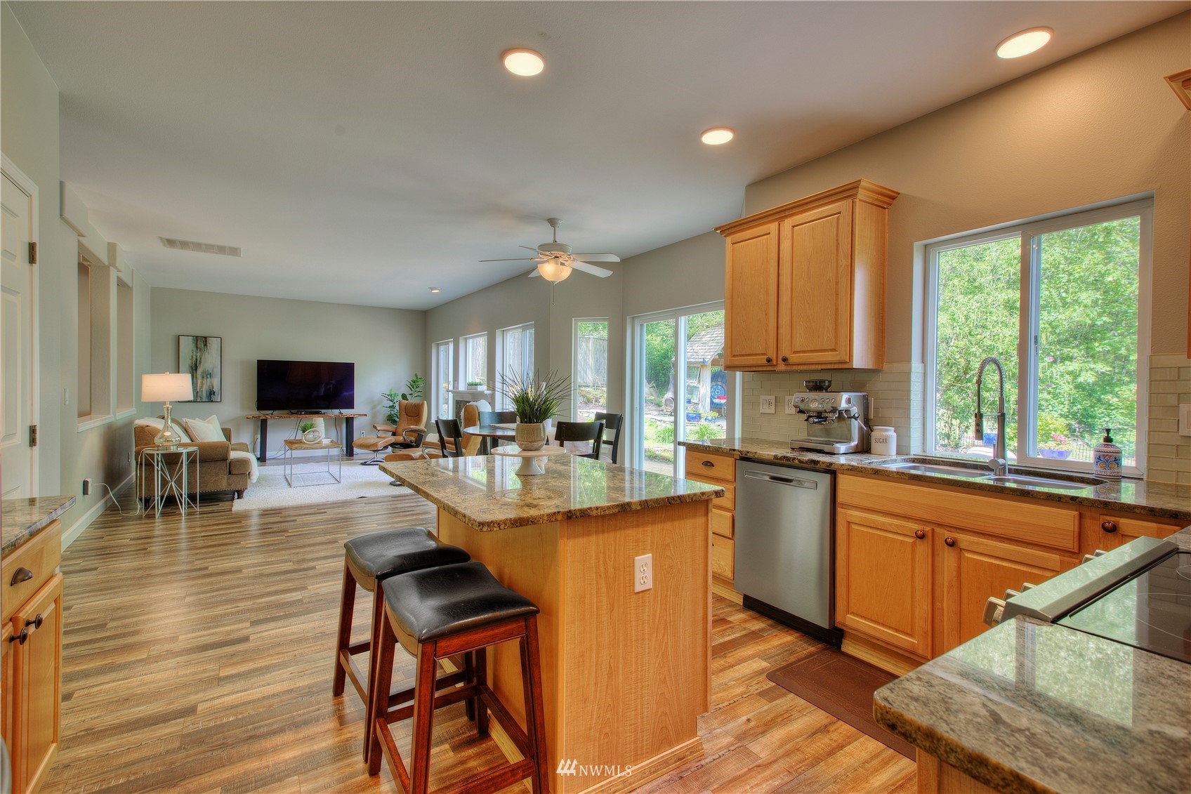 1127 R Street Northwest Auburn, WA 98001 - Photo 12 of 37 a kitchen with stainless steel appliances granite countertop sink stove top oven and cabinets