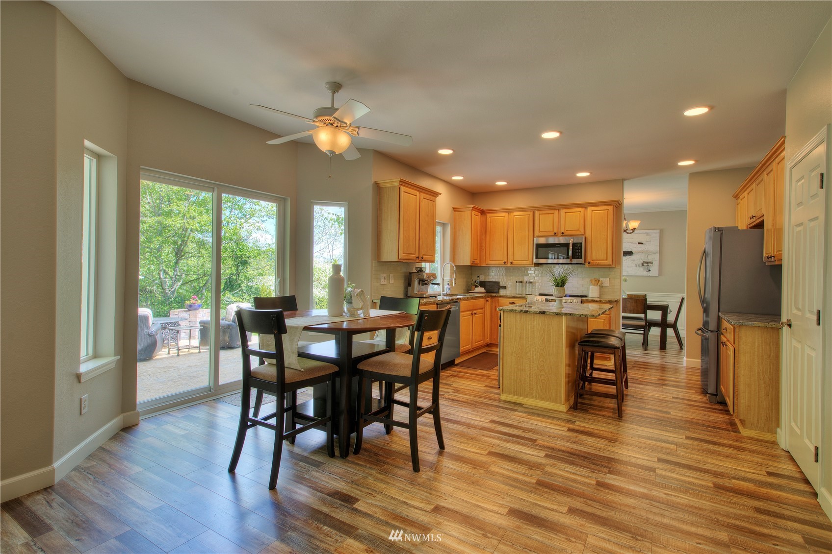 1127 R Street Northwest Auburn, WA 98001 - Photo 15 of 37 a view of a dining room with furniture window and wooden floor