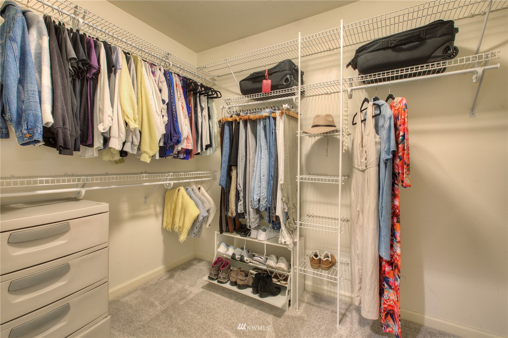 1127 R Street Northwest Auburn, WA 98001 - Photo 22 of 37 a view of walk in closet with clothes and shoes