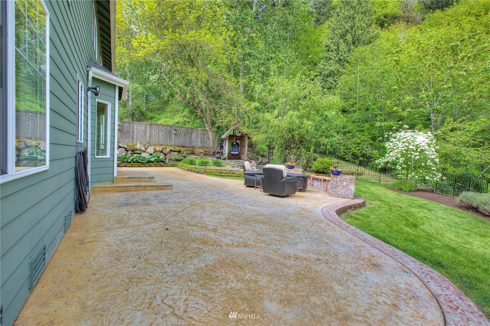 1127 R Street Northwest Auburn, WA 98001 - Photo 30 of 37 a view of backyard with outdoor seating and green space
