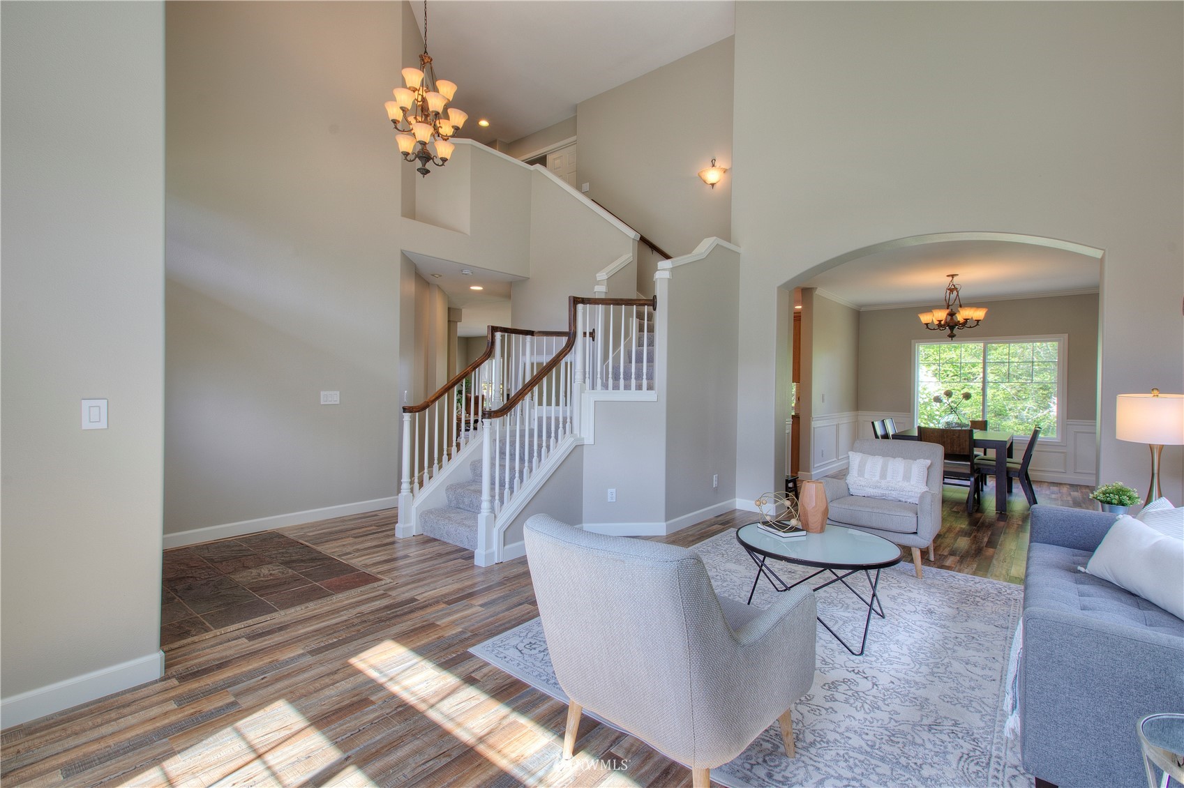 1127 R Street Northwest Auburn, WA 98001 - Photo 9 of 37 a living room with couches painting on the wall and a potted plant
