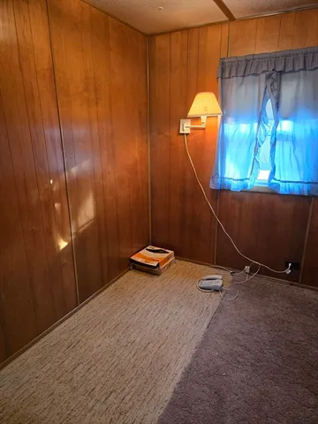 a room with a table and a chandelier