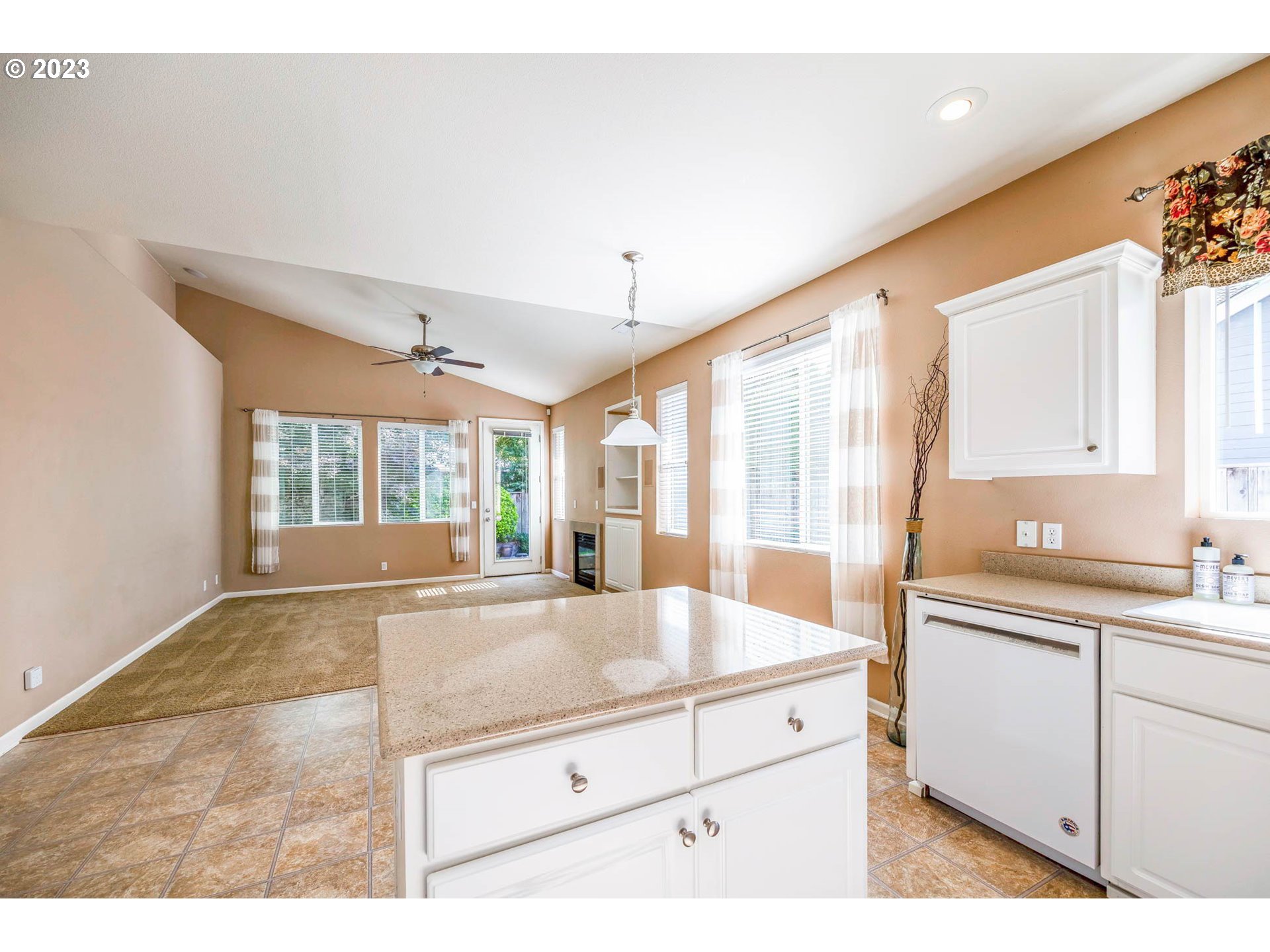 5408 Jeffrey Way Eugene, OR 97402 - Photo 11 of 37 a large white kitchen with granite countertop a large window