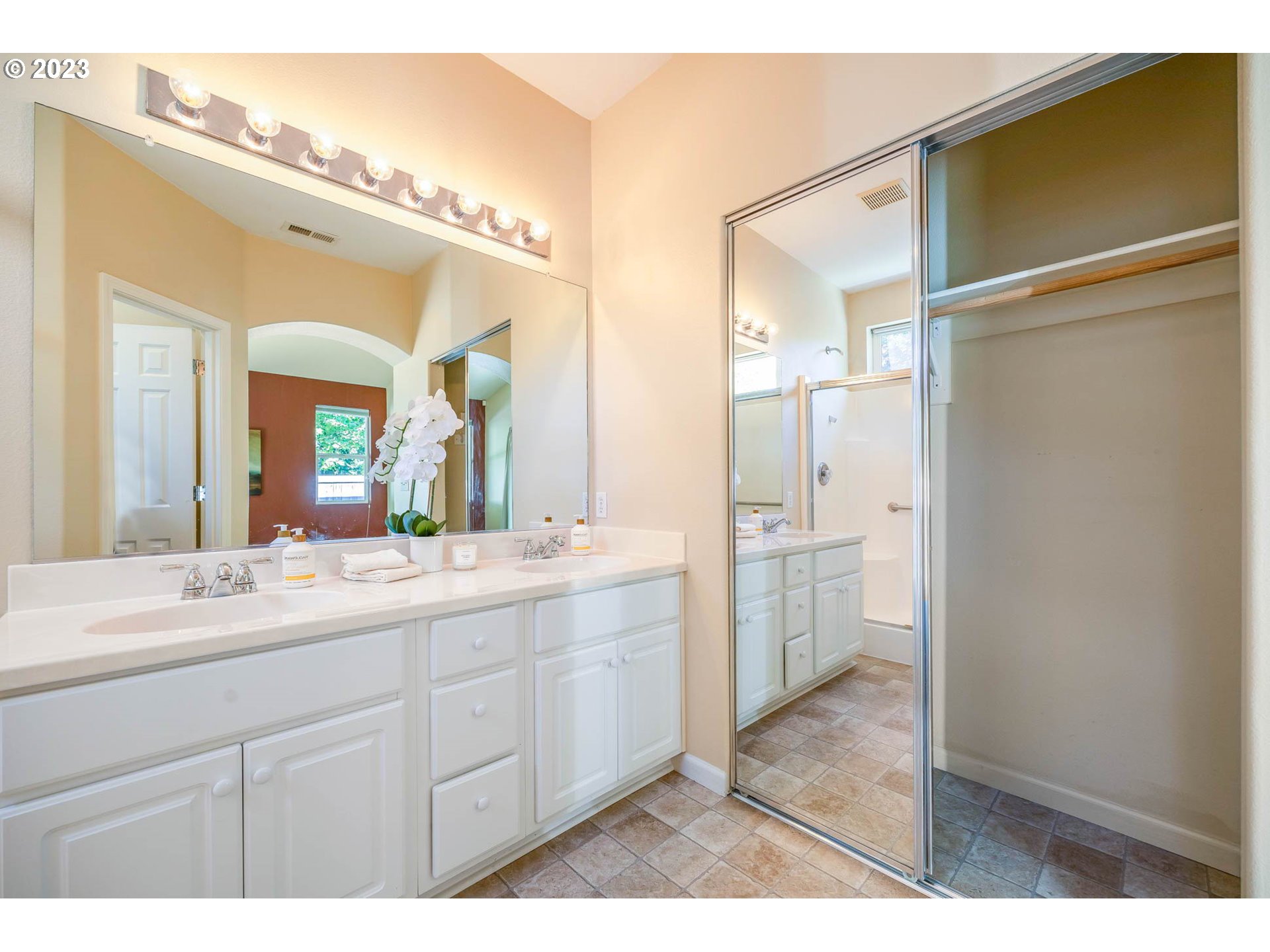 5408 Jeffrey Way Eugene, OR 97402 - Photo 21 of 37 a bathroom with a double vanity sink and mirror