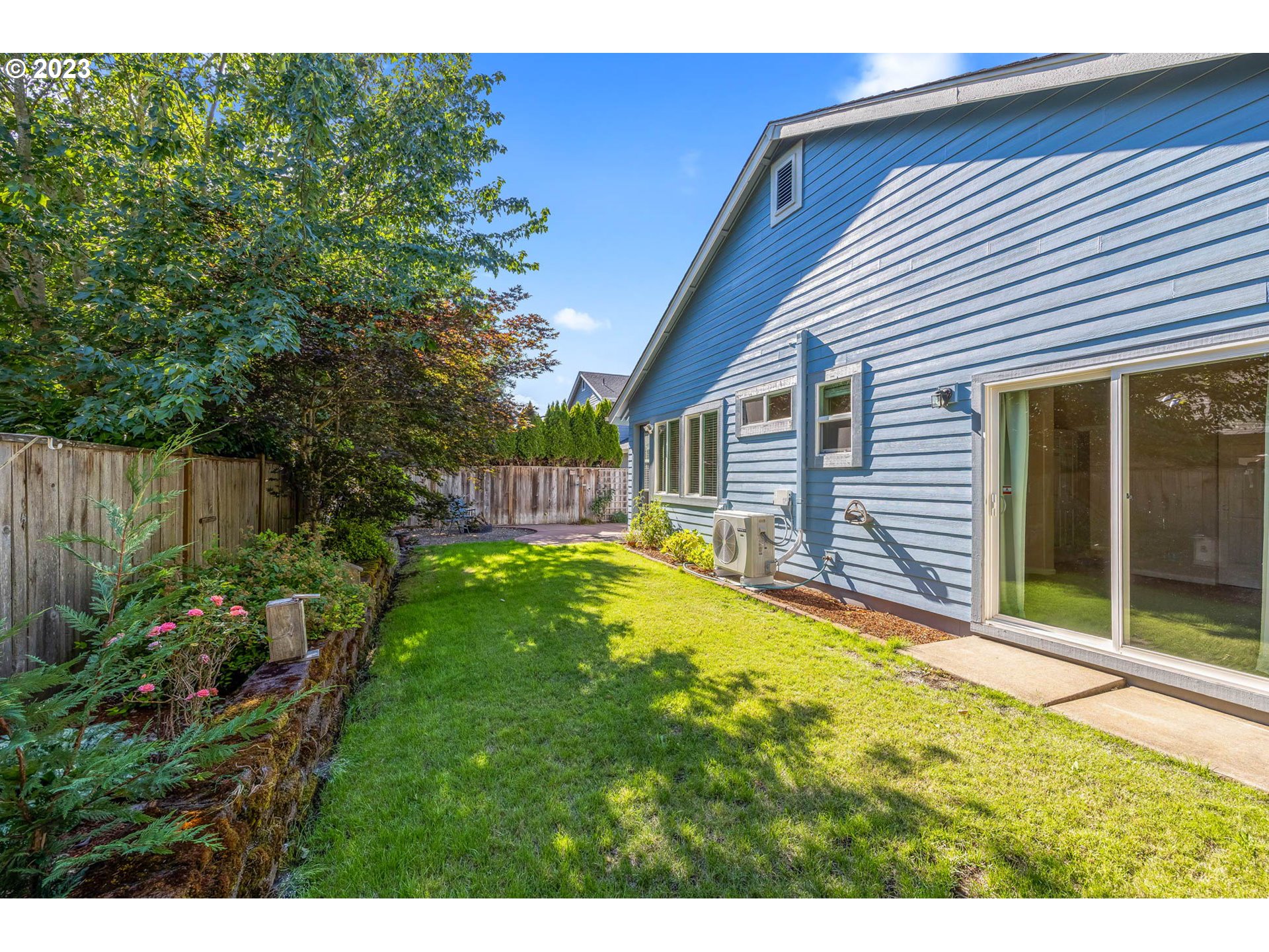 5408 Jeffrey Way Eugene, OR 97402 - Photo 33 of 37 a view of a backyard with table and chairs and wooden fence