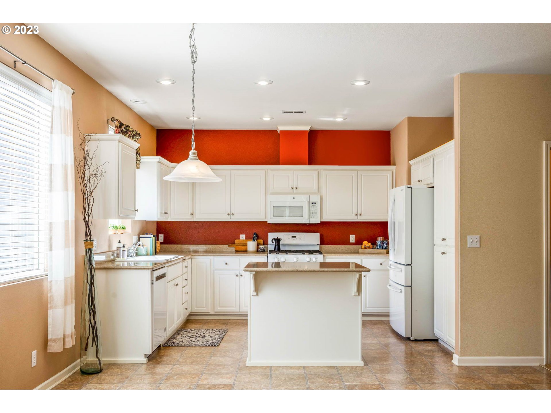 5408 Jeffrey Way Eugene, OR 97402 - Photo 6 of 37 a kitchen with stainless steel appliances kitchen island granite countertop a sink and cabinets