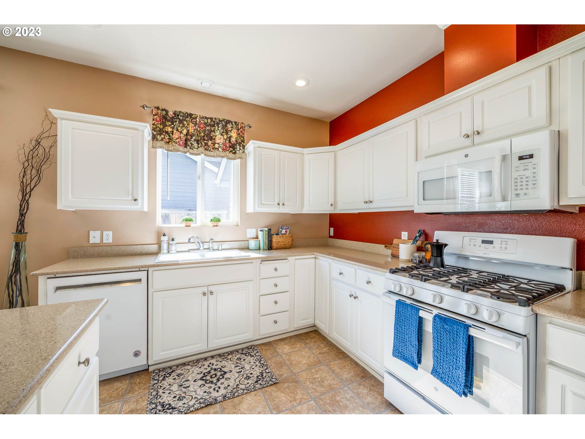 5408 Jeffrey Way Eugene, OR 97402 - Photo 9 of 37 a kitchen with granite countertop a sink stove and cabinets