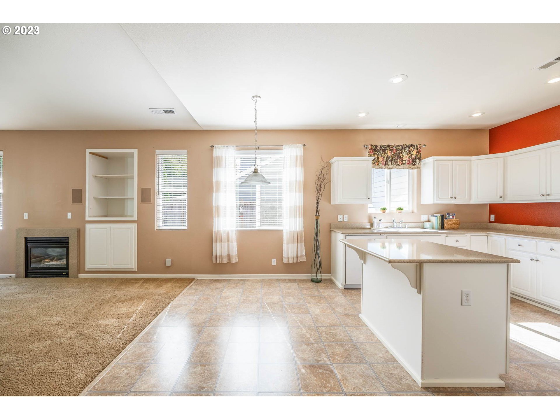 5408 Jeffrey Way Eugene, OR 97402 - Photo 10 of 37 a open kitchen with granite countertop a sink and white cabinets