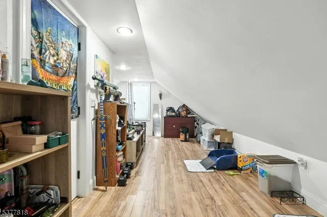 a view of a living room with clothes and shoes
