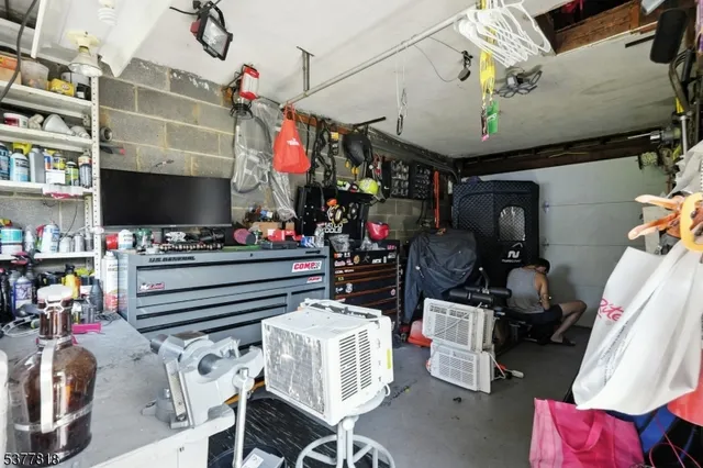 a room with furniture and a flat screen tv