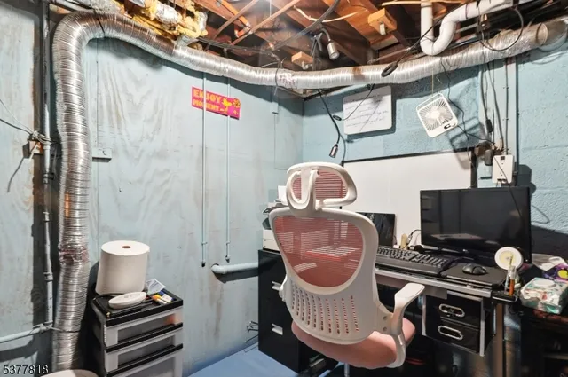 a room with chairs and a chandelier