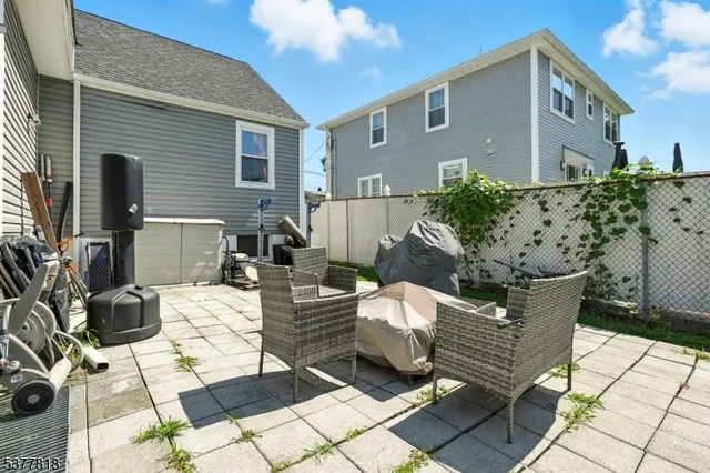a view of a patio with couple of chairs