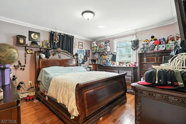 a bedroom with bed and a large mirror