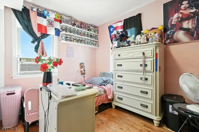 a bed room with a bed and a television