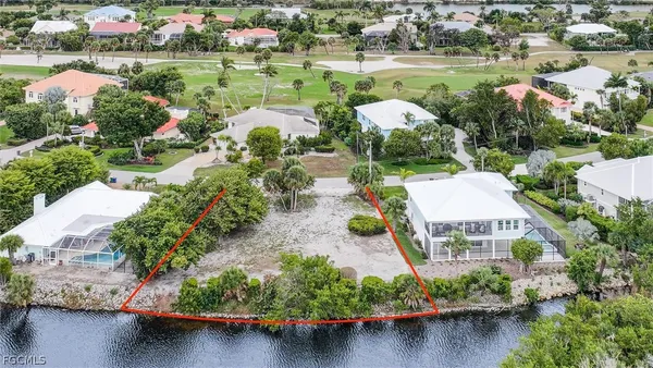 an aerial view of a house with a lake view