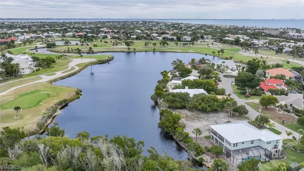 an aerial view of a house with a lake view