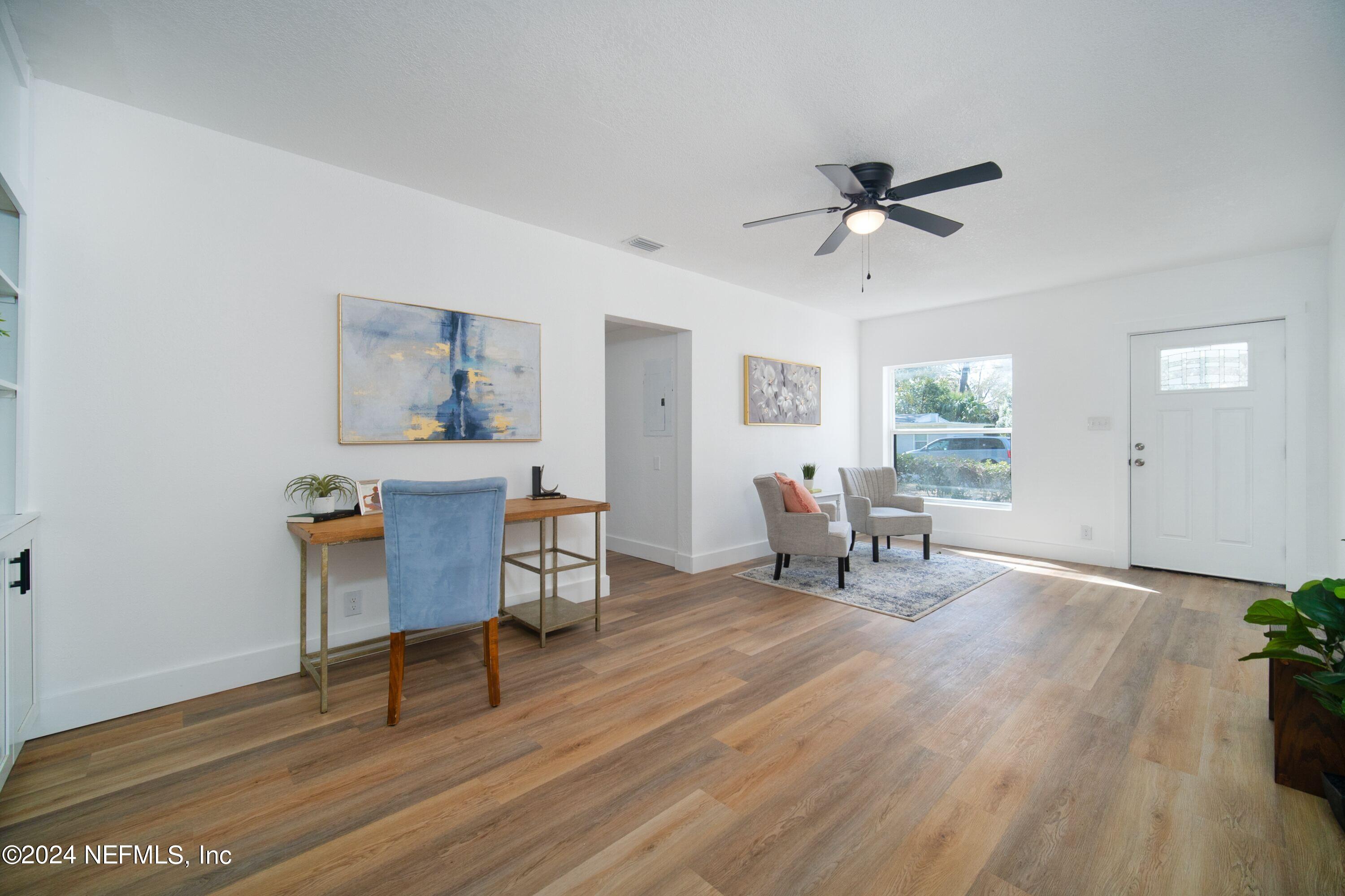 2589 Springmont Street Jacksonville, FL 32207 - Photo 12 of 71 a living room with furniture and wooden floor