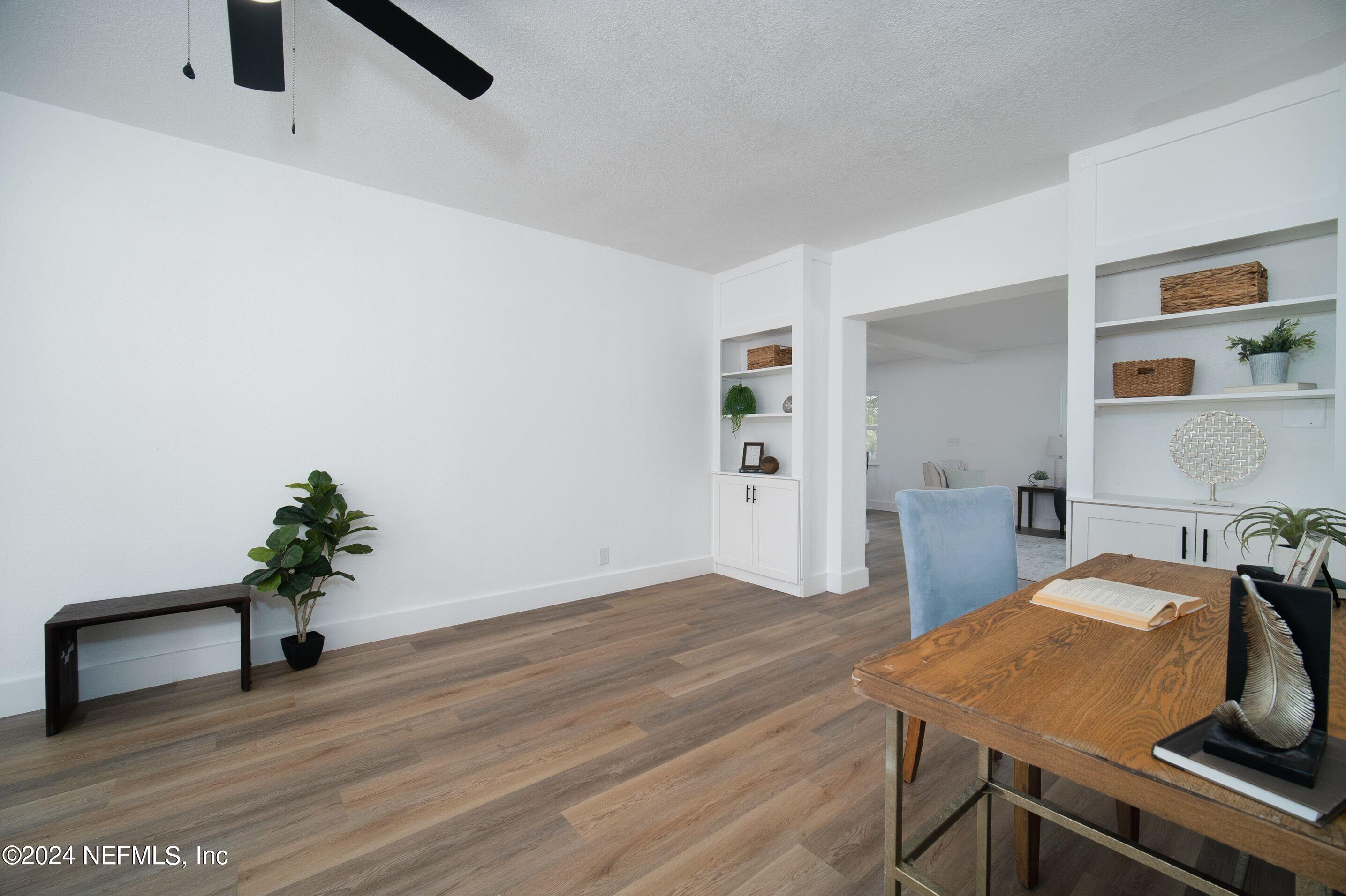2589 Springmont Street Jacksonville, FL 32207 - Photo 14 of 71 a workspace with furniture and wooden floor