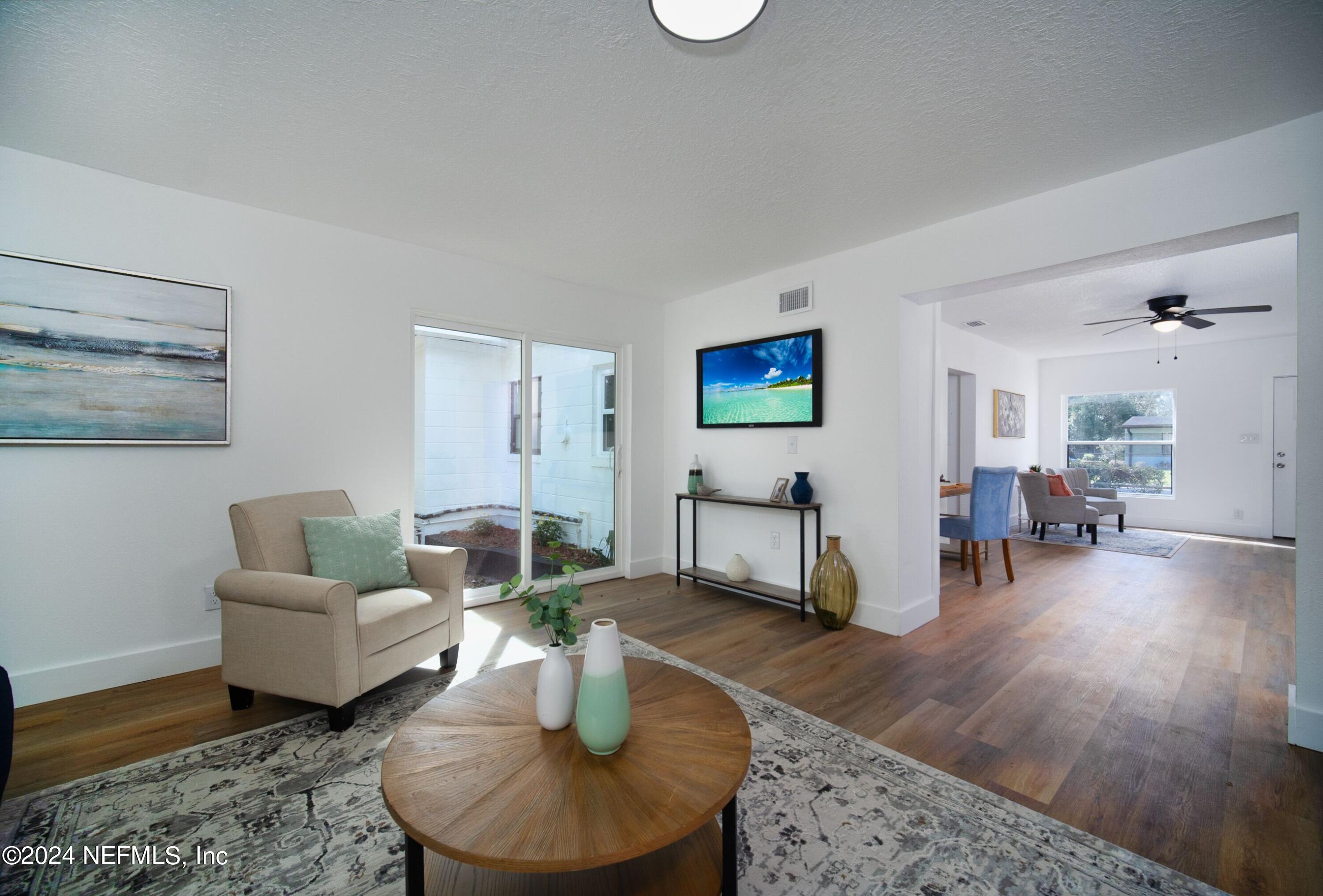 2589 Springmont Street Jacksonville, FL 32207 - Photo 17 of 71 a living room with furniture and wooden floor