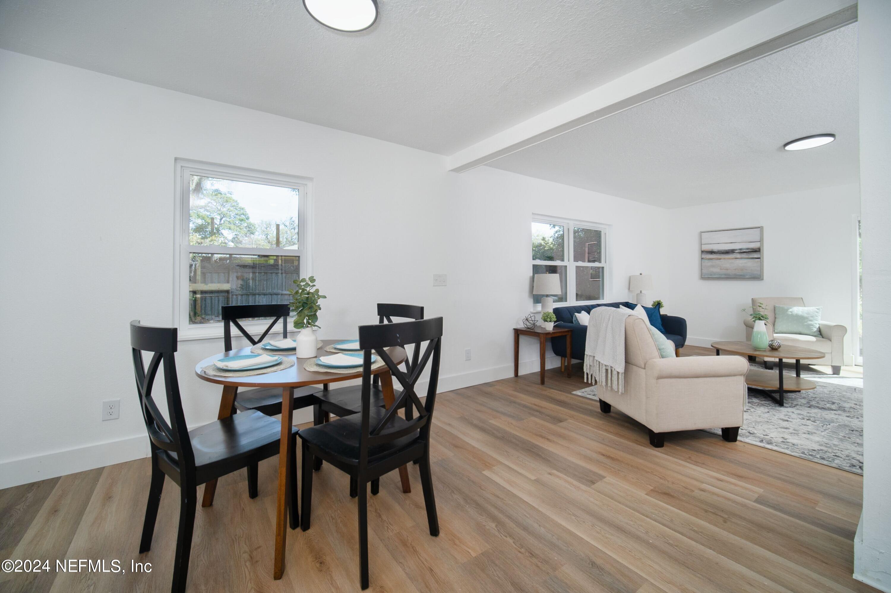 2589 Springmont Street Jacksonville, FL 32207 - Photo 22 of 71 a view of a livingroom with furniture and a wooden floor